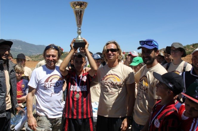 Presenting the winning team with the trophy