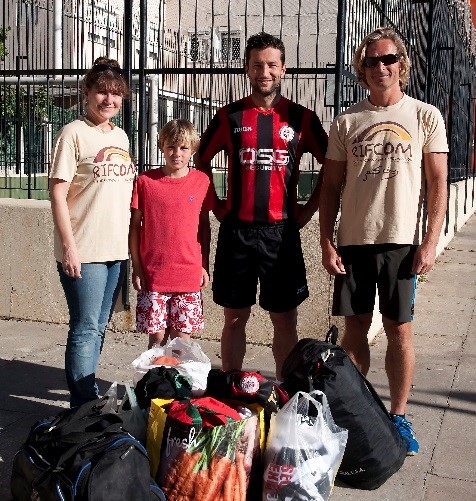 RifCom team members receiving donated kit from Lincoln FC Gibraltar before the event